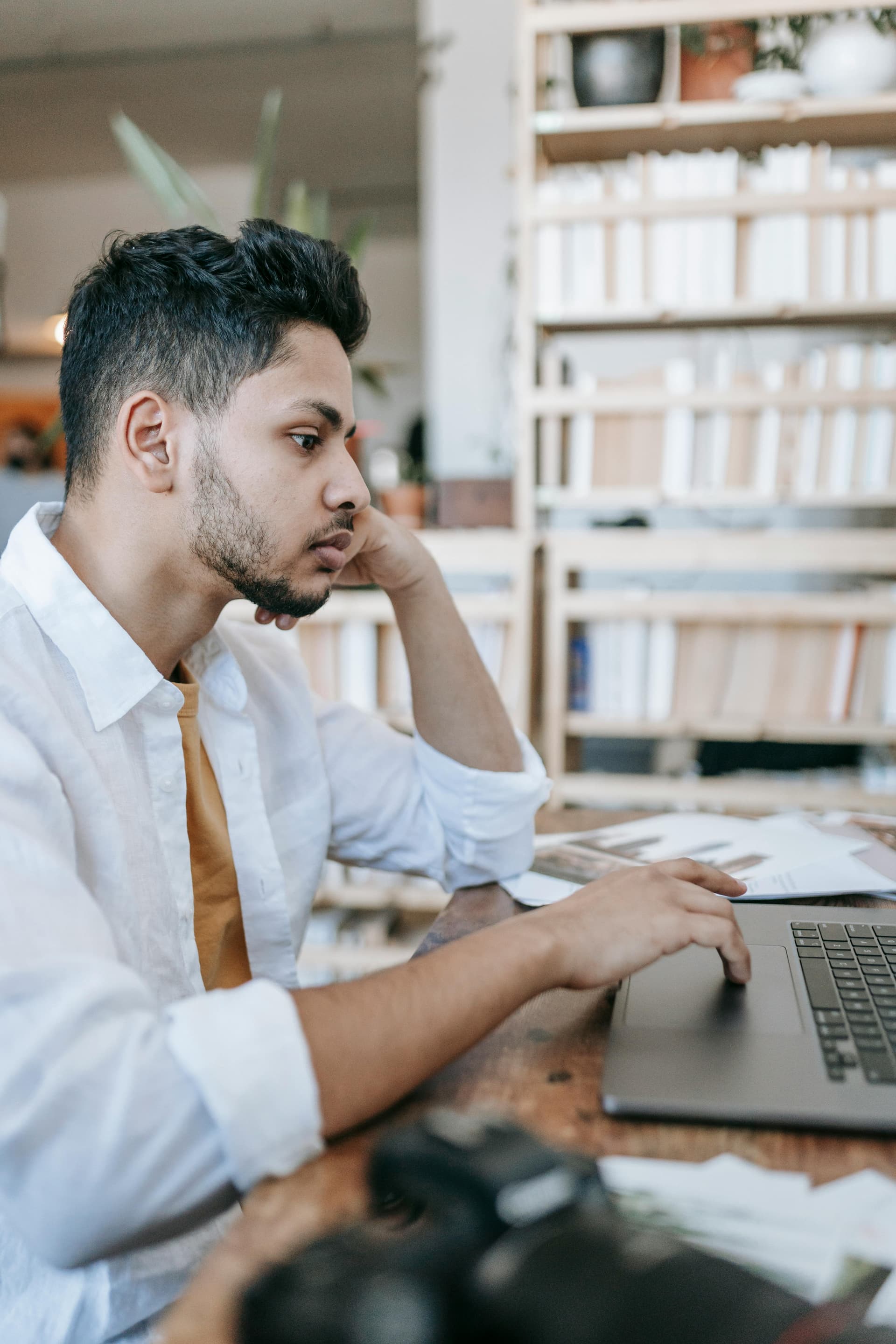 Creator reviewing campaign work on a laptop